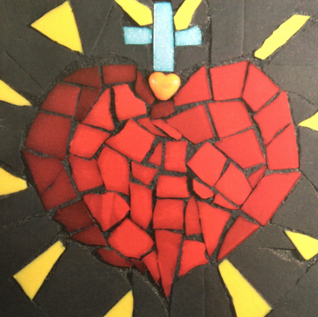 Mosaic of red tile pieces in shape of a heart, surmounted by a crucifix. Yellow rays radiate out from the heart.